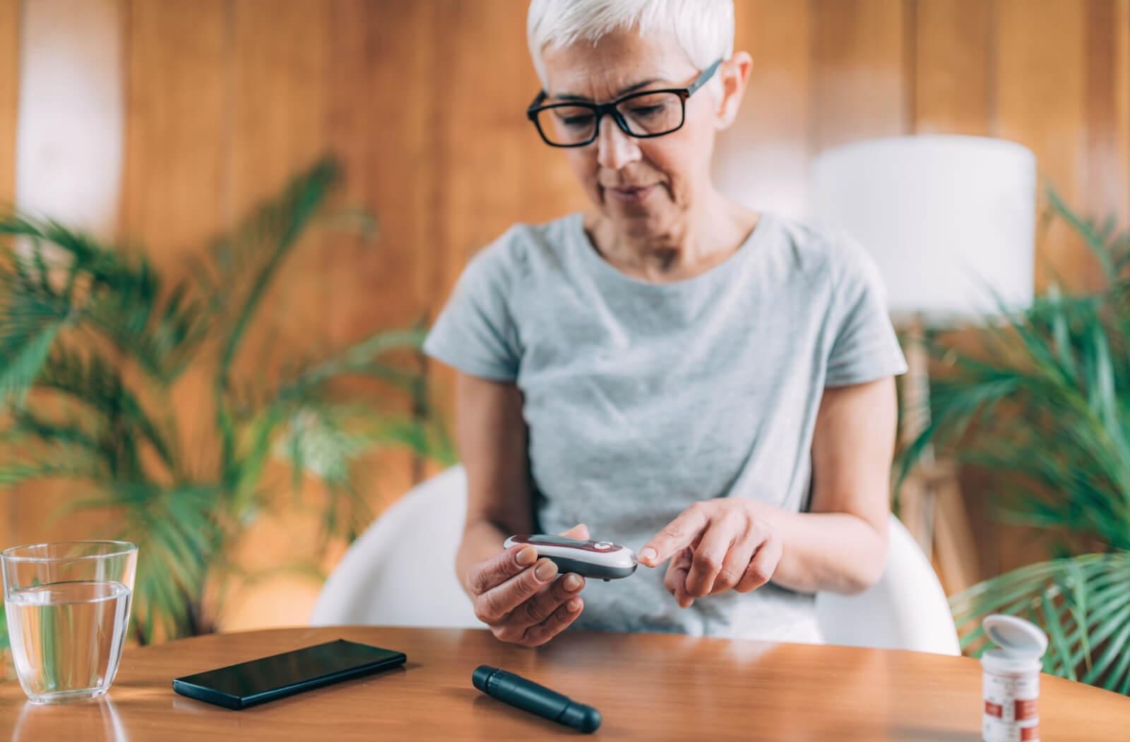 A person with diabetes monitoring their blood sugar levels.